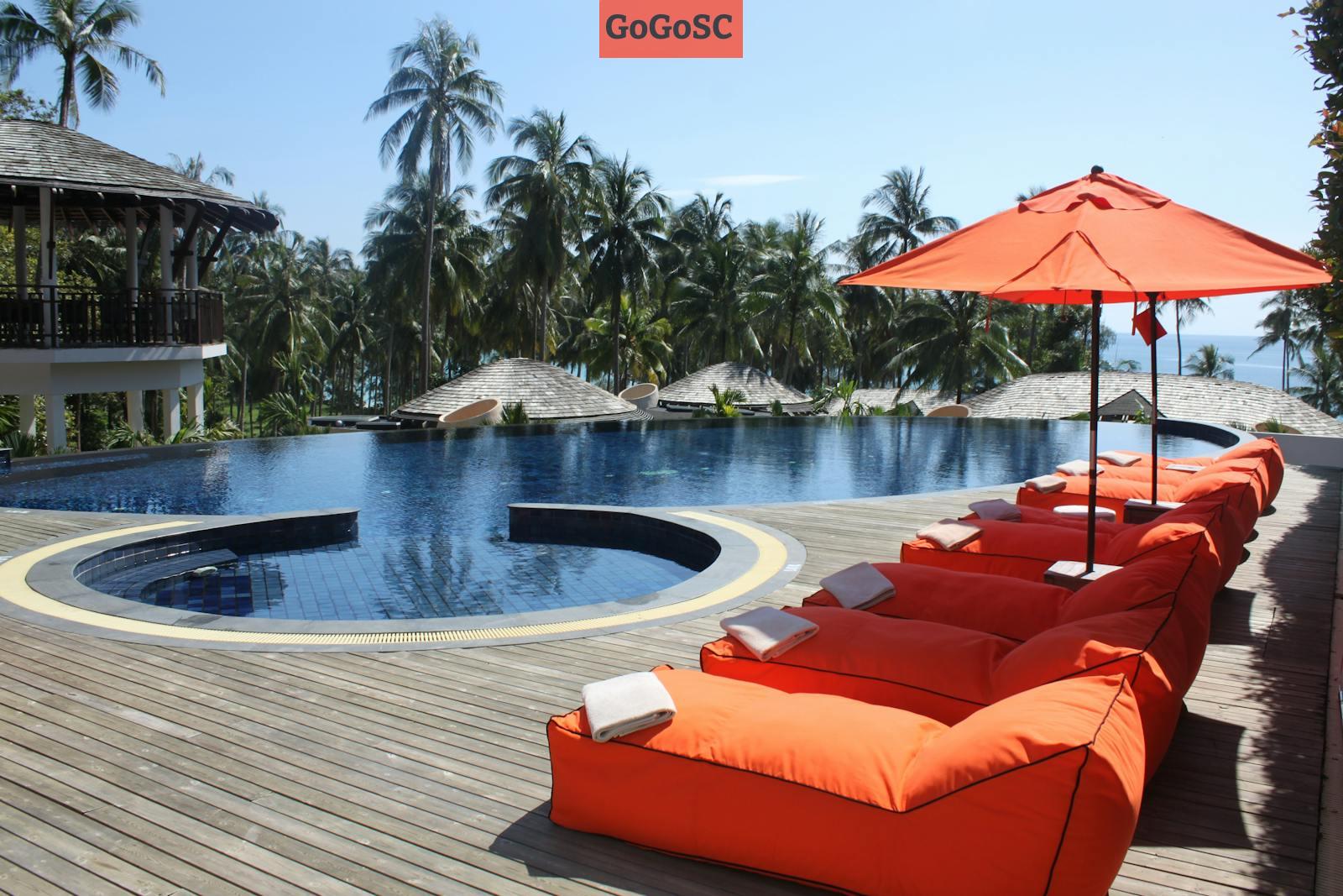 Orange Lounges Near Swimming Pool