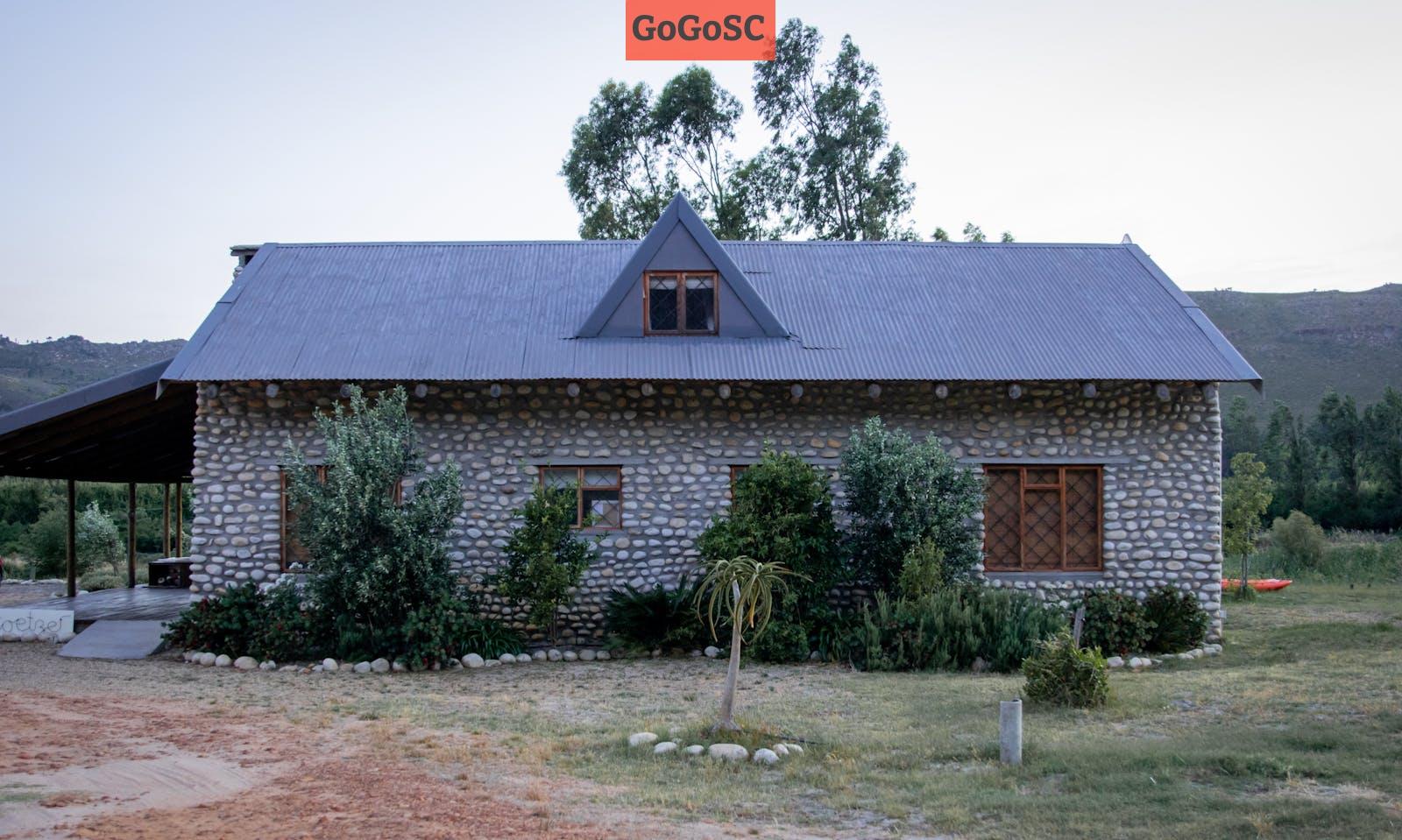 Gray Concrete House Surrounded with Trees